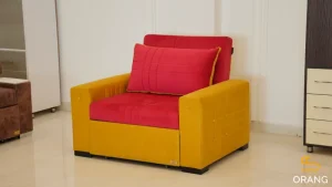 مبل تخت خوابشو 1 نفره ریلی اورنگ در حالت نشیمن با طراحی مدرن و پارچه فستو نرم و بادوام، مناسب برای استراحت و استفاده روزمره.