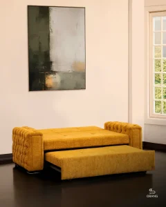 نمای مبل تخت خوابشو دو نفره ریلی مدل ۱۴۰ در حالت نیمه تخت برای استراحت روزانه و حالت لم، با طراحی شیک و دسته چستر لمسه‌دوزی‌شده